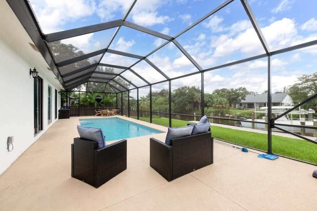 Photo of 314 NE Surfside Avenue, Port Saint Lucie, FL 34983 (MLS # B26058511)