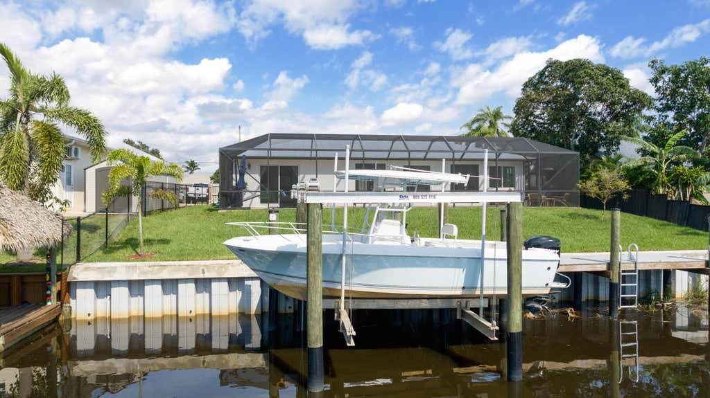 Photo of 314 NE Surfside Avenue, Port Saint Lucie, FL 34983 (MLS # B26058511)