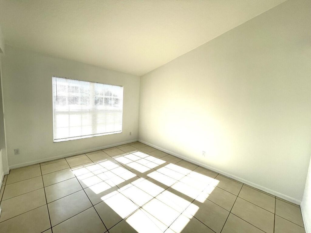 Photo of 1061 SW Coleman Avenue, Port Saint Lucie, FL 34953 (MLS # B26005783)