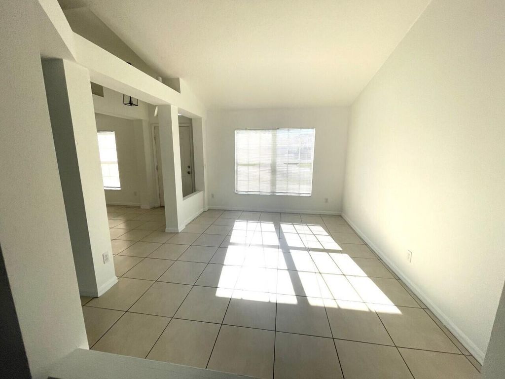 Photo of 1061 SW Coleman Avenue, Port Saint Lucie, FL 34953 (MLS # B26005783)