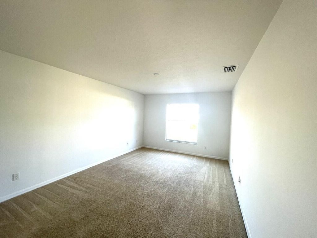 Photo of 1061 SW Coleman Avenue, Port Saint Lucie, FL 34953 (MLS # B26005783)