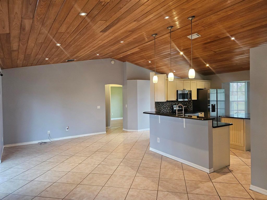 Photo of 4243 SW Utterback Street, Port Saint Lucie, FL 34953 (MLS # R11018136)