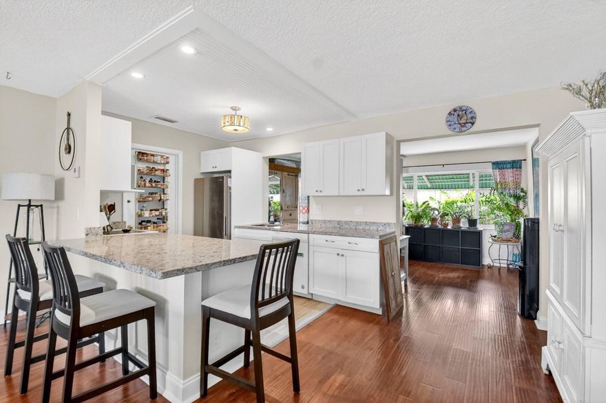 HURRY! All the heavy lifting has been done here. Roof, full impact windows, paid REC Lease ($25K value), and newer appliances including fridge (6 months), washer (2018), dryer (2024), and dishwasher (3 yrs). The beautifully upgraded kitchen with large island and top-of-the-line granite countertops flows into a spacious layout and bright Florida/sunroom—perfect for extra living space or home office. Low HOA of $184 covers exterior maintenance, lawn care, pest control, pressure washing, painting, and more. Only $25/month for cable & 500 Mbps internet. Private backyard and 1-car garage for added storage.  Located in desirable Palm Beach Leisureville, enjoy a vibrant 55+ lifestyle with 3 heated pools, clubhouses, fitness center, hot tub, and FREE 18-hole golf. Prime  Boynton Beach location near beautiful Delray Downtown, sandy Atlantic beaches, minutes to shopping, dining, medical centers, I-95, and PBI Airport—move-in ready. This home won't last!