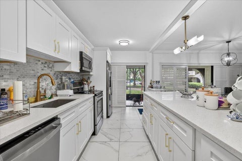 Photo of 6328 W Longboat Ln Lane W #101, Boca Raton, FL 33433 (MLS # B26025719)