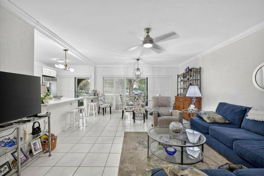Photo of 6328 W Longboat Ln Lane W #101, Boca Raton, FL 33433 (MLS # B26025719)