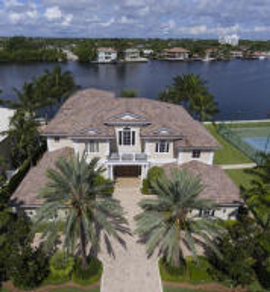 In the lush and tranquil Old Florida beauty of Seagate, a desirable beachside neighborhood, this exceptional direct Intracoastal estate fronts a broad basin-like stretch of the waterway providing scenic wide-open water views and yacht dockage in a no-wake zone. Expertly custom built by A.M. Nicolli Construction, a high-end South Florida firm, the five-bedroom Palm Beach Georgian-inspired residence radiates an understated elegance befitting the charm of its gracious island-side surroundings.  Exotic Canary island date palms and privacy hedges flank the entrance court that approaches the front portico.The information herein is deemed reliable and subject to errors, omissions or changes without notice.  The information has been derived from architectural plans or county records. SEE MORE