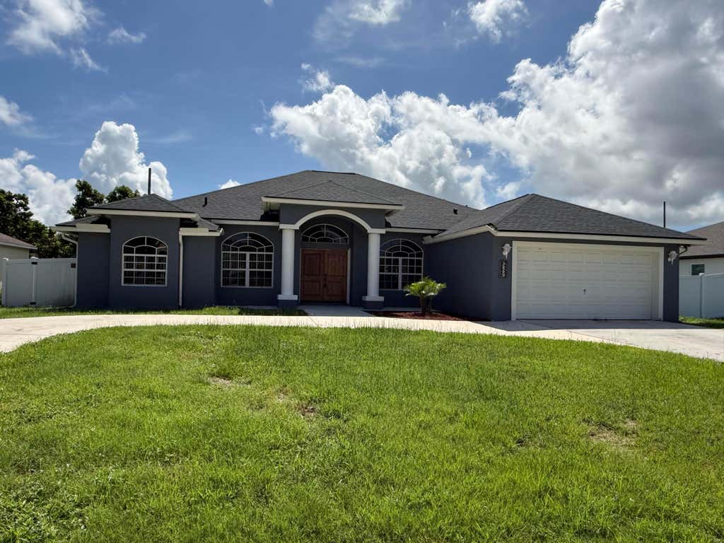 Photo of 3849 SW Mckim Street, Port Saint Lucie, FL 34953 (MLS # B26053062)