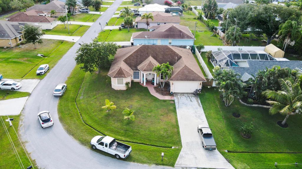 Photo of 2001 SE Parrot Street, Port Saint Lucie, FL 34952 (MLS # R11089083)