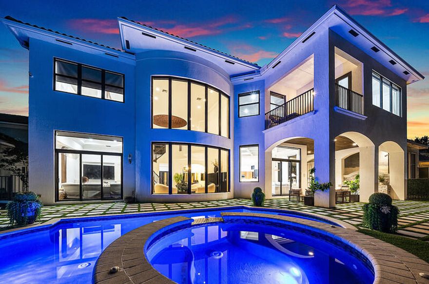 The Dominique model is widely regarded as one of the most coveted estates within The Oaks of Boca Raton, valued for its grand proportions, timeless layout, and exceptional livability. This impressive residence has been thoughtfully enhanced with meaningful updates that offer both comfort and peace of mind, including hurricane-impact windows installed in 2022 and all four AC systems replaced in 2022. The outdoor living experience has been transformed into a private retreat. A fully renovated patio and pool feature new Diamond Brite finish and tile, a refined turf landscape design, and porcelain pavers throughout the patio, creating a sophisticated yet relaxed setting ideal for entertaining. A custom built-in grill area completes this resort-style environment. Inside, updated kitchen and bar cabinetry complement expansive living areas designed for both elegant gatherings and everyday enjoyment. Residents enjoy access to an exceptional lifestyle anchored by a grand clubhouse, spa, dining, state-of-the-art fitness center, and a highly regarded tennis and pickleball program featuring multiple Har-Tru clay tennis courts, professional instruction, leagues, and social playsetting The Oaks apart as one of Boca Raton's most dynamic luxury communities. A rare opportunity to own one of The Oaks' signature estateswhere scale, sophistication, and lifestyle converge.