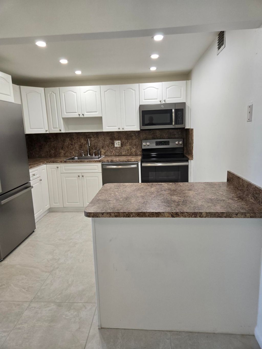 Photo of 208 Wellington E #208, West Palm Beach, FL 33417 (MLS # B26025106)