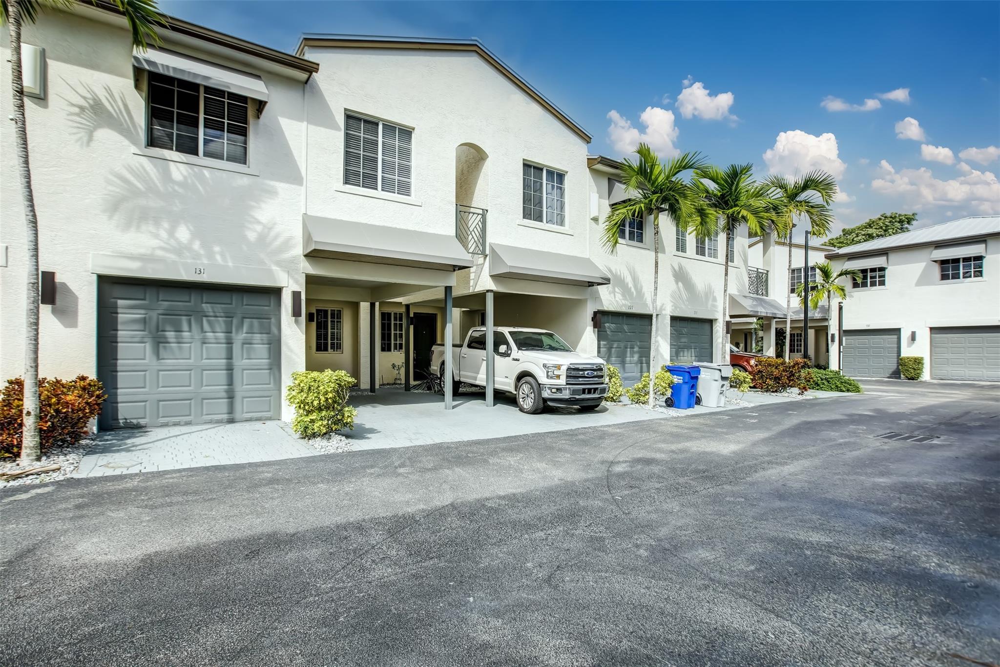 Experience luxurious living in this stunning townhouse, fully remodeled with an open floor plan and high ceilings, creating an airy and spacious atmosphere. It includes 3 bedrooms and 2½ baths, featuring two walk-in closets in the master bedroom for ample storage. The property also offers a one-car garage and an additional covered parking spot within a sought-after gated community. High-impact windows and an aluminum roof enhance energy efficiency to help reduce cooling costs. Conveniently located just 1.5 miles from the newly renovated Pompano Beach, this home beautifully combines elegance and convenience. May rent townhome 2 times a year at a minimum of 3 months