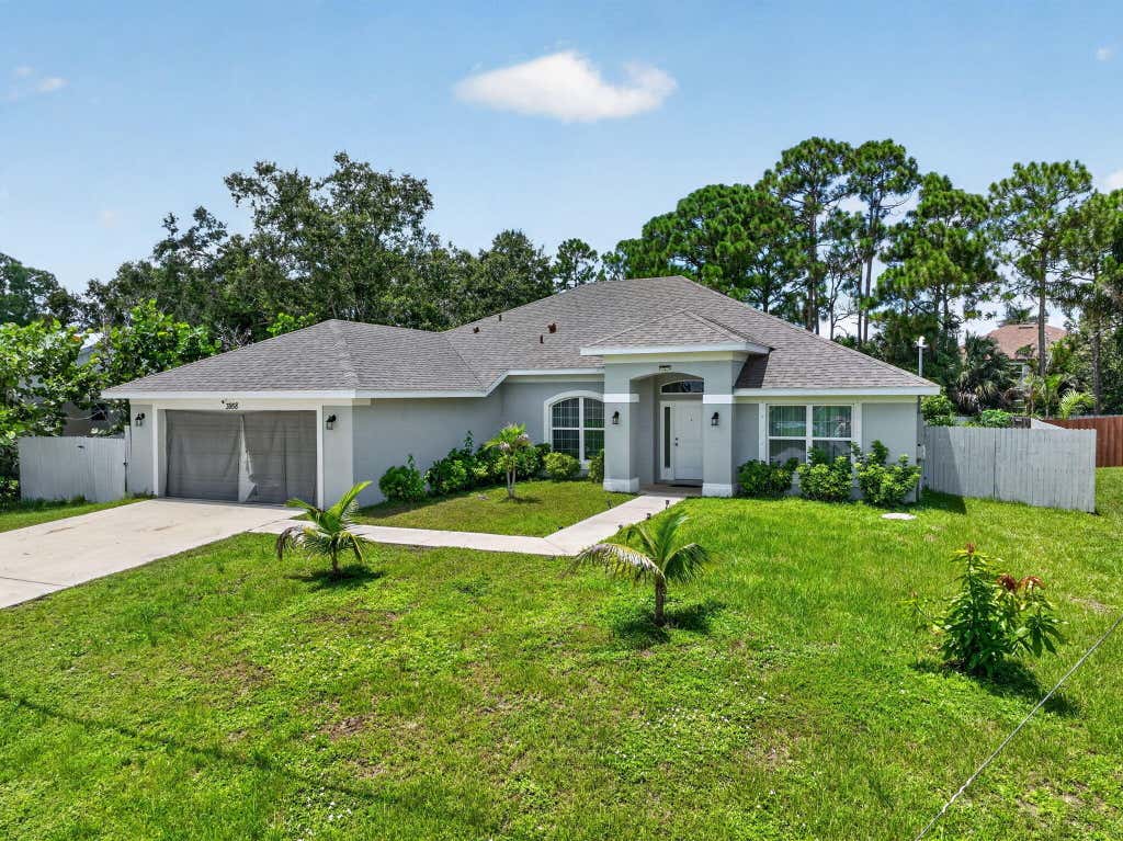 Photo of 3958 SW BRUNSWICK Street, Port Saint Lucie, FL 34953 (MLS # B26062110)