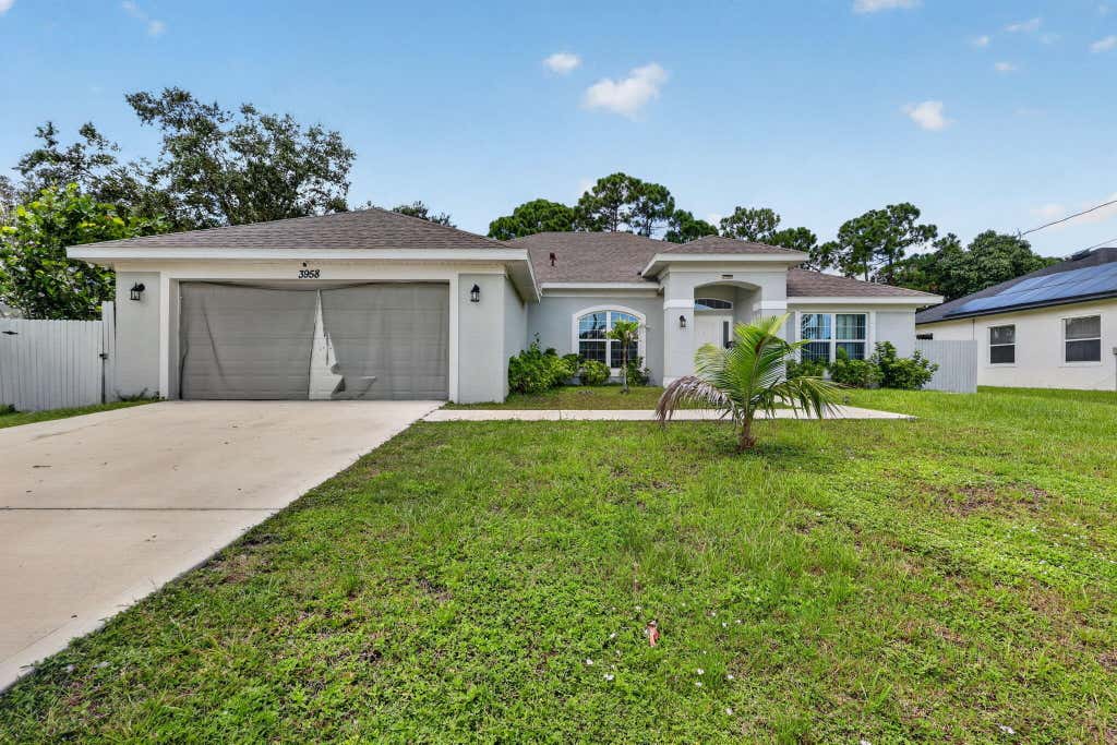 Photo of 3958 SW BRUNSWICK Street, Port Saint Lucie, FL 34953 (MLS # B26062110)