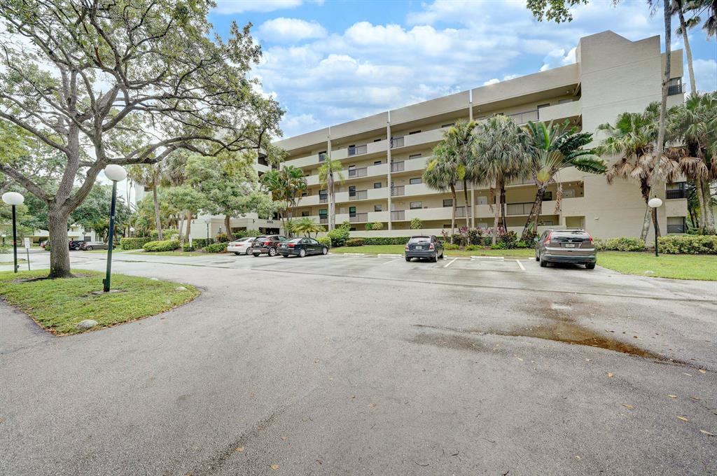 Spacious 2/2 in highly desired community Tradewinds Condo in Coconut Creek, Open floor plan with lake view from the living and master bedroom, Newly renovated vinyl flooring in master and front bedrooms, master bedroom and customized built-in walk-in closet.. as well as newly remodeled master bathroom done in 2020. Washer and dryer in the unit. Storage unit near the elevator. HOA includes basic cable, water/sewer, secured lobby, elevator, $360/month and Quarterly Master Association fee is $166 which includes all Township Amenities. Olympic size pool, ballroom, clubhouse & live theater w/movie screenings, large gym with updated equipment, walking trails all through the community, library, racquetball, and billiards table.