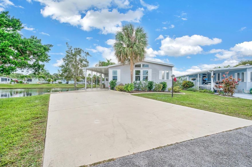 Come take a look at this LAND OWNDED, magnificent home with panoramic lake views located in Savanna Club (55+) community! This house has been completely renovated from top to bottom! As you walk in you have a spacious Florida room with magnificent views of the lake. Brand new tile flooring throughout. BRAND NEW, fully updated kitchen with quartz countertops, custom shaker cabinets, and new appliances! The master bathroom has been completely updated featuring dual sinks, a stand alone bath tub and a new shower with custom glass. BRAND NEW ROOF, NEW A/C UNIT (2023), NEW WINDOWS, NEW HOT WATER HEATER, NEW ELECTRICAL PANEL AND NEW WATER LINES!