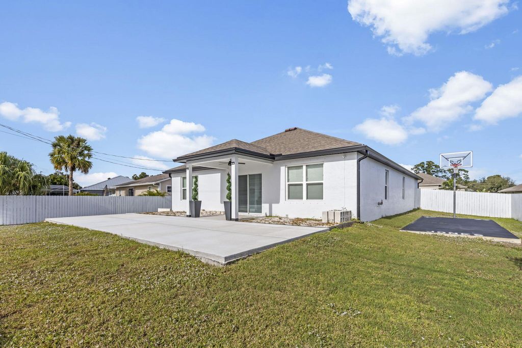 Photo of 2368 SW Neal Road, Port Saint Lucie, FL 34953 (MLS # R10941699)