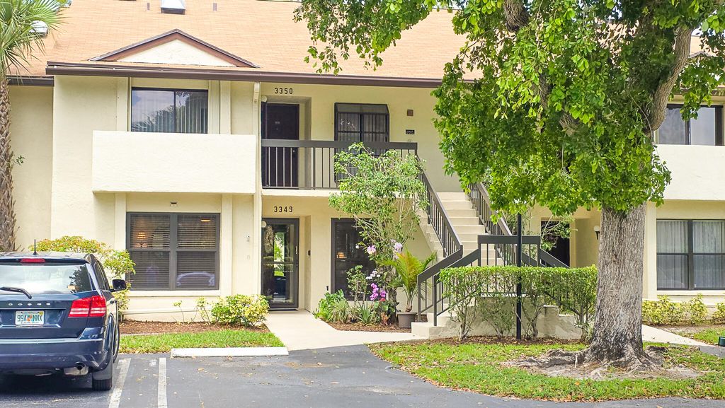Photo of 3349 Perimeter Drive, Greenacres, FL 33467 (MLS # B26030028)