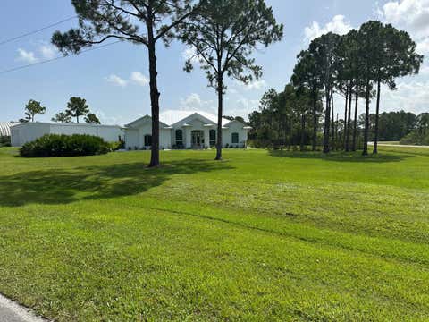 Photo of 12374 Grumman Way, Port Saint Lucie, FL 34987 (MLS # B26053961)