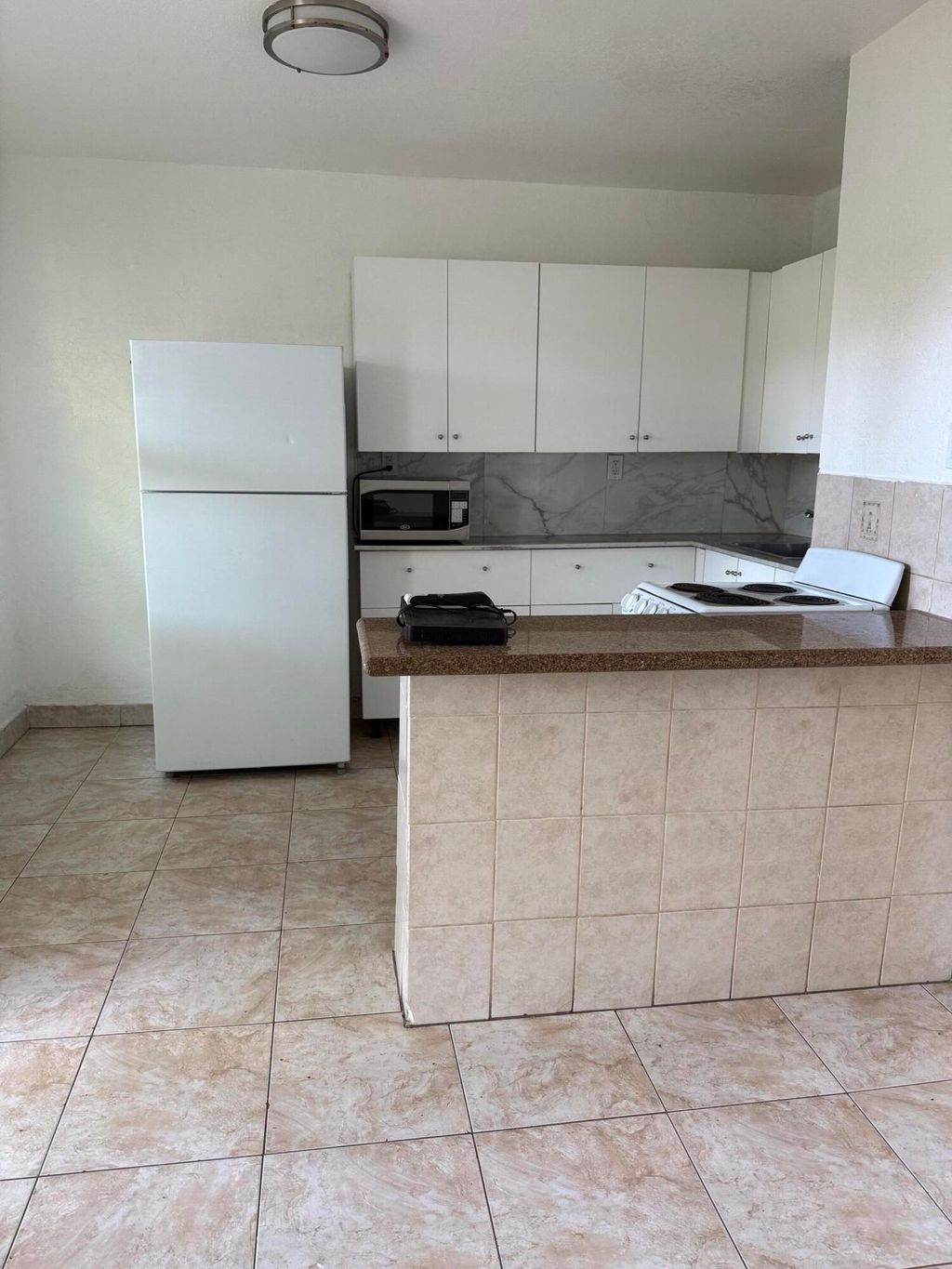 Photo of 705 NE 3rd Street #2, Hallandale Beach, FL 33009 (MLS # B26026298)