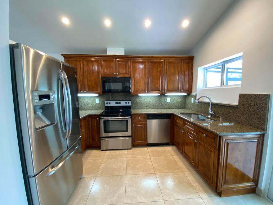 Updated 3/2/2 on waterway with direct access to Lake Ida.**Just installed, impact glass throughout, front door and garage door, saving you $ on electric bills. Newer kitchen w/ granite, real wood cabinetry and stainless-steel appliances. Freshly painted, popcorn ceilings removed, and high-hat lights added. Living room has brand new wood-look ceramic tile flooring, cathedral ceilings and sliders to tiled screened covered patio and water views. Large open formal dining room has pass-through to kitchen. Master suite w/ New tile flooring, updated bath, Jacuzzi tub and custom closet system. Guest bath also updated w/ shower stall. Paver atrium allows for natural light. Guest bedrooms with new tile flooring. HOA maintains lawn care and sprinklers off the lake. Amenities: Heated pool, jacuzzi,