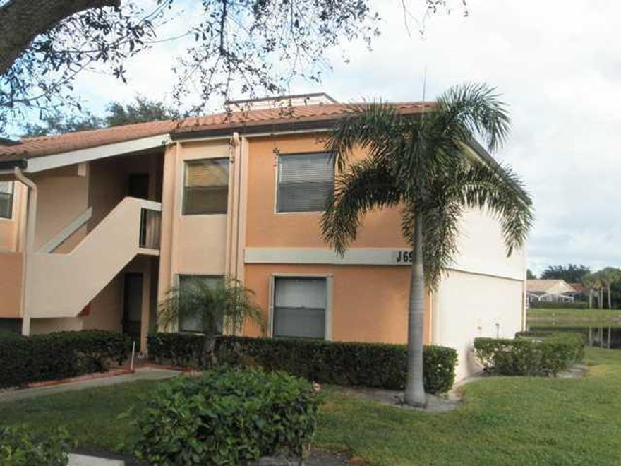 Garden level (lake view) unit is bright, airy and aesthetically inviting.  Stone floors in main living areas. Screen Enclosed Patio overlooks lake. Excellent view.