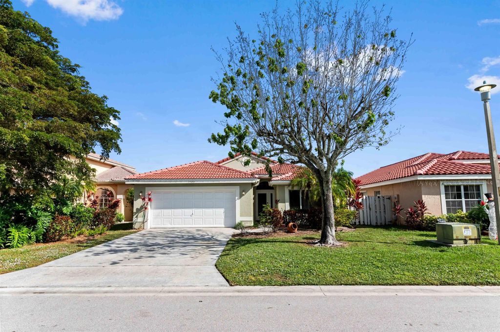 Photo of 7409 Michigan Isle Road, Lake Worth, FL 33467 (MLS # R11146938)