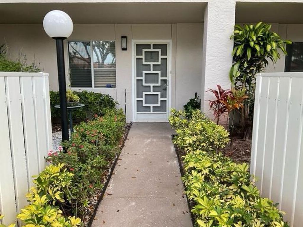 Photo of 14096 Huntington Pointe Dr #102, Delray Beach, FL 33484 (MLS # R10778214)