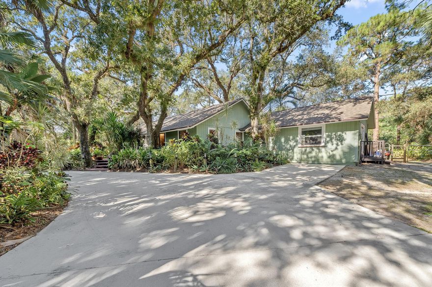 A rare opportunity to own a private retreat bordering Riverbend Park, just minutes from the back entrance offering miles of biking, running, walking, kayaking, and equestrian trails. This serene 1.25-acre property is tucked beneath a canopy of majestic old oak trees, creating a peaceful, nature-rich setting.The spacious ranch-style home features an open floor plan anchored by a beautiful stone fireplace, making it ideal for both everyday living and entertaining. New wood flooring runs throughout the entire house with tile in the bathrooms.  The custom kitchen offers granite countertops, 6 burner gas stove, 2 ovens, ample cabinetry, and generous prep space for hosting family and friends.