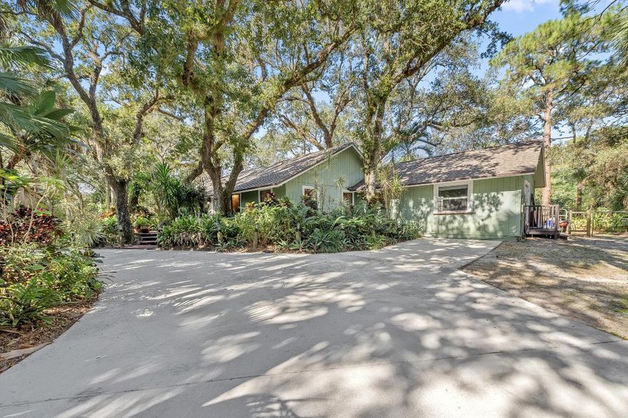 A rare opportunity to own a private retreat bordering Riverbend Park, just minutes from the back entrance offering miles of biking, running, walking, kayaking, and equestrian trails. This serene 1.25-acre property is tucked beneath a canopy of majestic old oak trees, creating a peaceful, nature-rich setting.

The spacious ranch-style home features an open floor plan anchored by a beautiful stone fireplace, making it ideal for both everyday living and entertaining. New wood flooring runs throughout the entire house with tile in the bathrooms.  The custom kitchen offers granite countertops, 6 burner gas stove, 2 ovens, ample cabinetry, and generous prep space for hosting friends. The home includes three spacious bedrooms, plus a converted garage/flex room - perfect for a recreation space, in-law suite, home office, or potential fourth bedroom. Step outside to the large screened back porch overlooking a tranquil pond, the perfect spot to relax and enjoy the natural surroundings.

Additional features include a large storage shed, smoke house, and an abundance of fruit trees. The newer concrete circular driveway with gated entry provides extra parking and space for an RV, boat, or multiple vehicles.