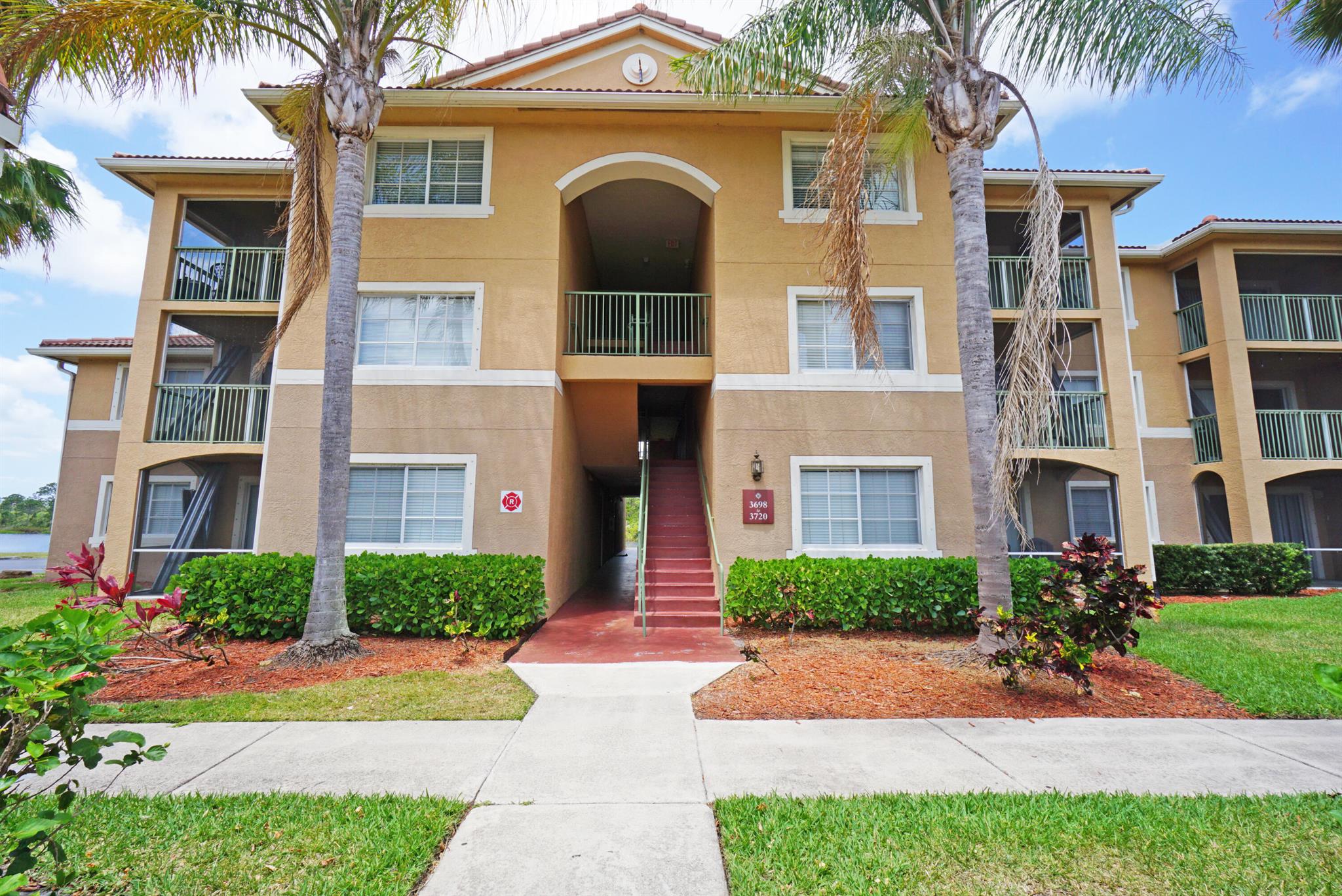 Discover this charming 2-bedroom, 2-bath condo located on the third floor, offering stunning views over the tranquil lake from the private balcony. The open layout provides a comfortable living space filled with natural light, perfect for relaxing or entertaining guests. The community is truly inviting, featuring a luxurious clubhouse and a beautifully large maintained pool, ideal for leisurely swims and social gatherings. Residents also enjoy access to a modern gym and racquetball courts, making it easy to stay active and healthy.Located just 10 to 15 minutes from the breathtaking beaches of Jensen Beach, this condo offers the perfect blend of peaceful lakeside living and convenient access to the area's natural beauty and attractions. Virtually staged photos have been added.