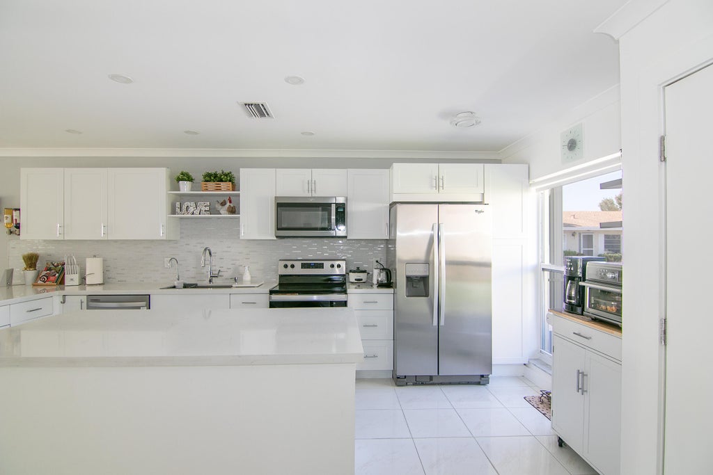 Photo of 13787 Flora Place #A, Delray Beach, FL 33484 (MLS # B26029228)