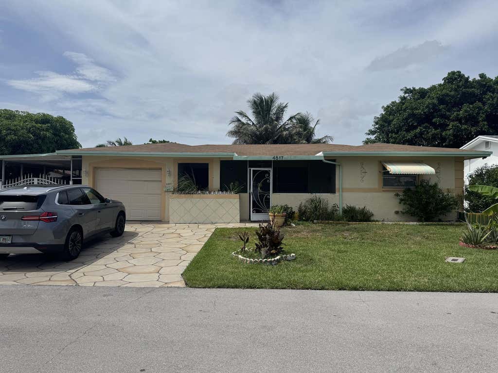 Photo of 4517 NW 49th Court, Tamarac, FL 33319 (MLS # B26050955)