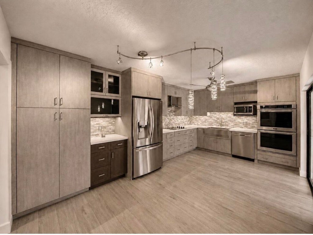 Photo of 502 5th Terrace, Palm Beach Gardens, FL 33418 (MLS # B26031543)