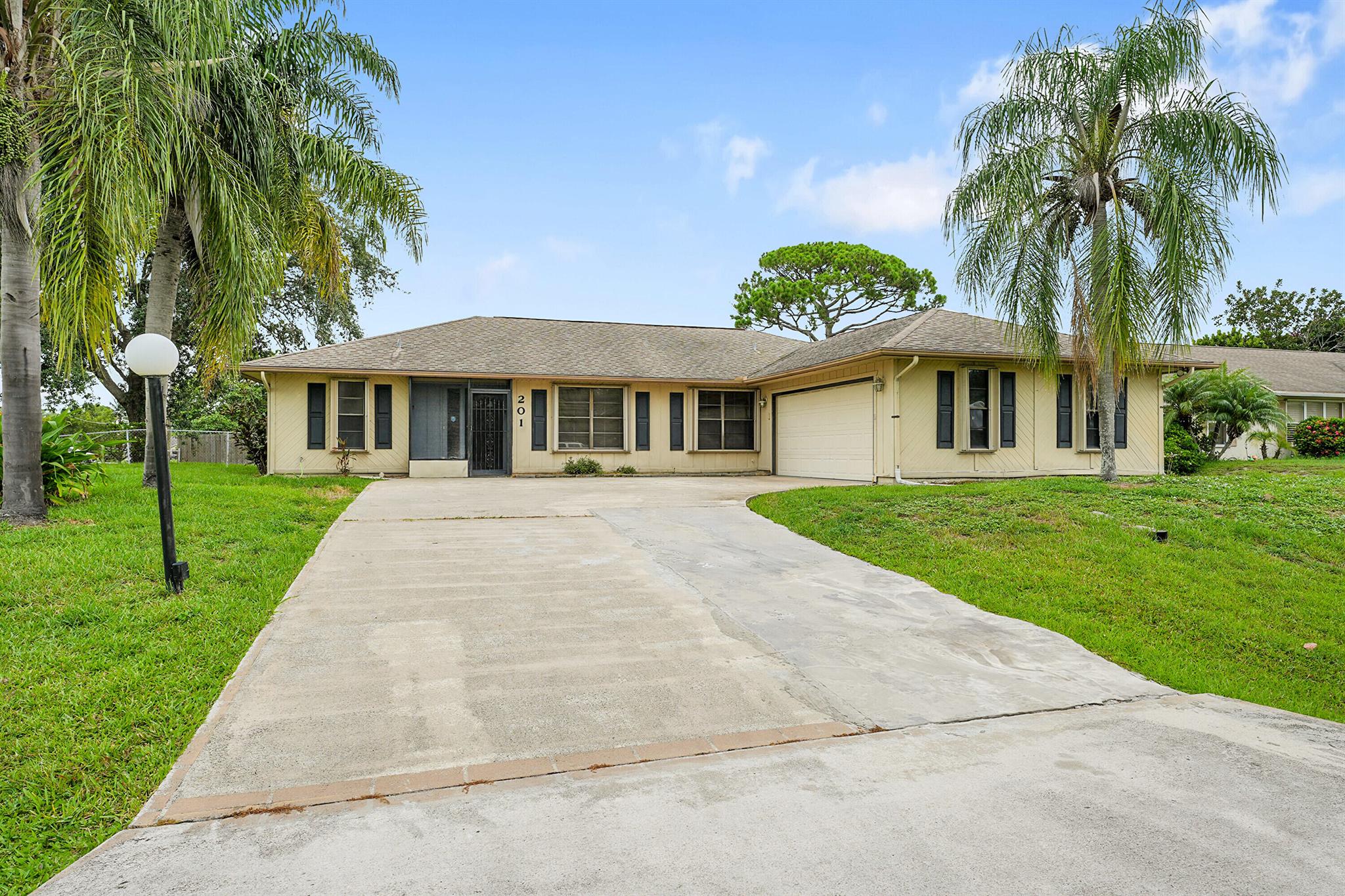 Welcome to your perfect South Florida retreat! This beautiful home sits on a spacious corner lot and features a fully fenced-in yarda"ideal for pets, play, or even a future pool, with plenty of room to make your outdoor dreams a reality. Designed for easy entertaining, the property offers a large, extended driveway that can accommodate multiple vehicles.Inside, enjoy peace of mind with recent upgrades including a new A/C (2024) and new water heater (2024). For storm protection, the home is equipped with accordion hurricane shutters throughout.Whether you're hosting family and friends or just enjoying a quiet evening in, this home offers the space, comfort, and security you've been looking for.