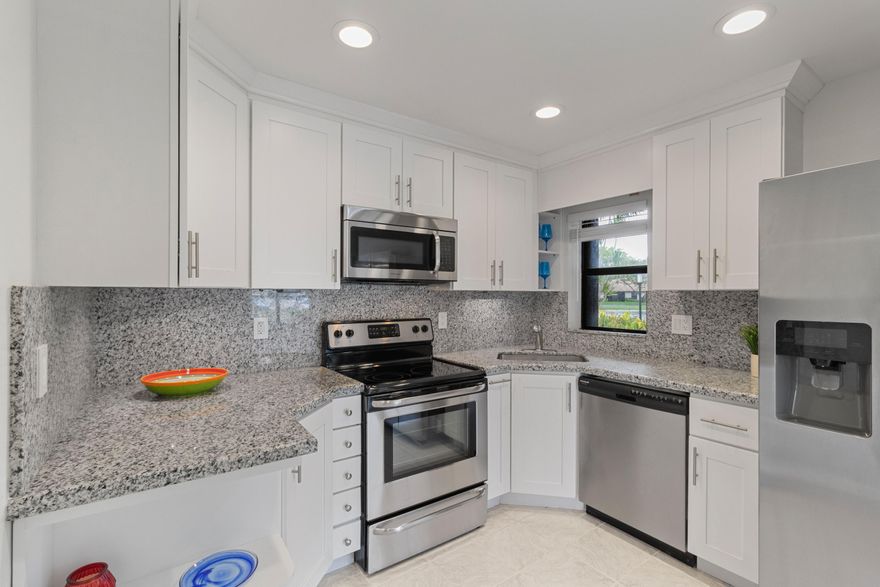 Beautiful updated and clean 3 bedroom, 2 Bathroom condo.   Gated community, ground floor, tile throughout, stainless steel appliances, washer and dryer!  Must see!