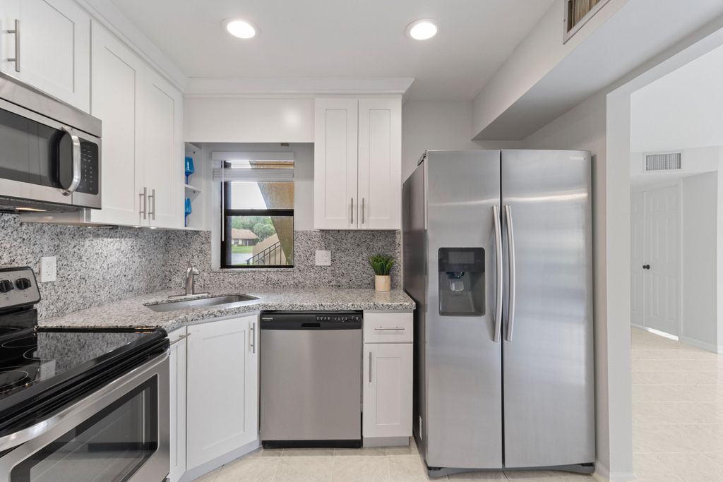 Photo of 8641 W Boca Glades Blvd Boulevard W #B, Boca Raton, FL 33434 (MLS # B26017600)