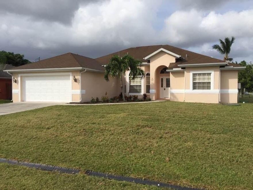 Single Family Home ready to move in.
This 3 bedroom possible 4 bedroom, 2 bath and 2 car garage home has been freshly painted inside and out. Tiles in main living areas, new carpet in bedrooms. All new light fixtures & fans. Granite counter tops in kitchen brand new stainless steal appliances. Covered screened in Patio.  Property is located on corner lot.