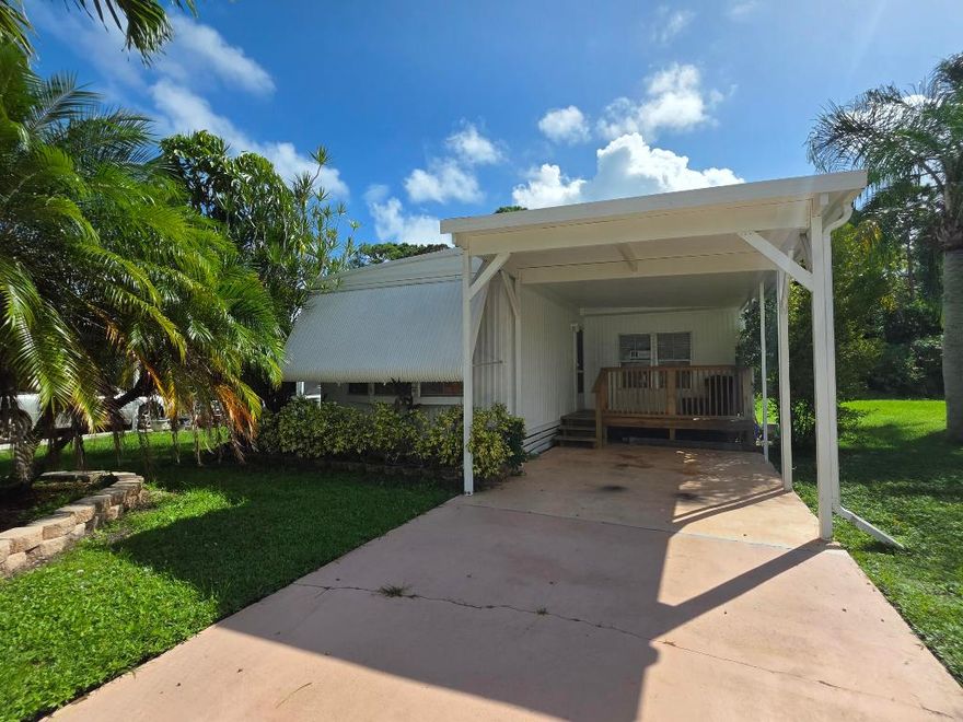 Welcome to Spanish Lakes Riverfront! This beautifully maintained 2-bedroom, 2-bath home offers  around 1,300 sqft. of comfortable living space, featuring an updated kitchen with modern finishes, and plenty of storage. Relax in the fully enclosed, under-air Florida Room—perfect for a home office, cozy den, or potential third bedroom! The spacious primary suite offers natural light, with flooring ready for your personal touch. Set on a private lot backing up to a wooded forest, this home provides peace, privacy, and a serene backdrop. Located in a vibrant 55+ community with resort-style amenities and a monthly lot lease of $898.77, this home delivers comfort, flexibility, and true Florida lifestyle. Schedule your showing today!