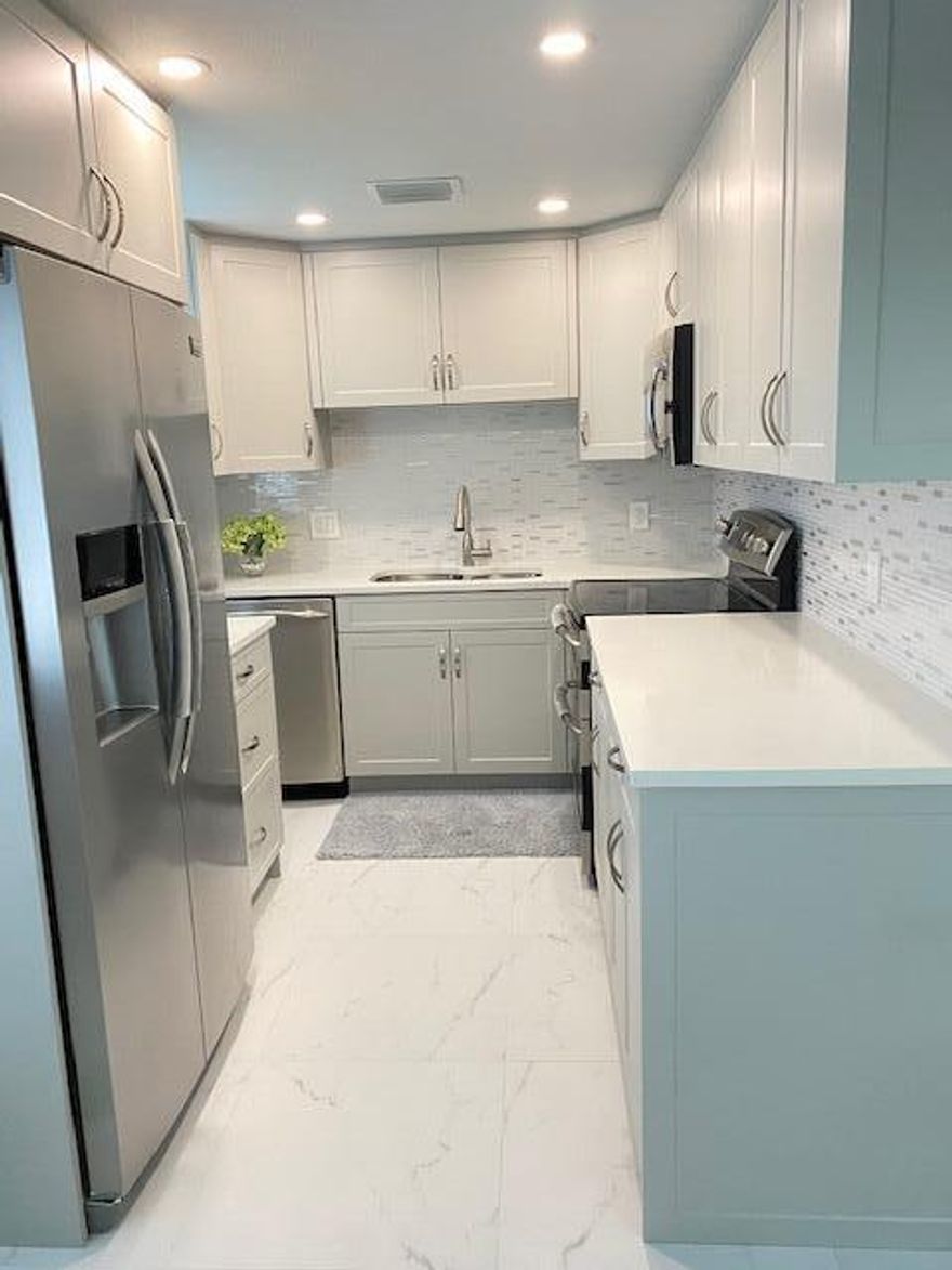 Beautiful newly and tastefully remodeled two bedroom one and a half bath. Convenient first floor unit with gorgeous tropical garden views in 55+community. Brand new kitchen and appliances. Brand new hurricane impact windows and doors were installed for your security and a peace of mind. Only tile throughout apartment. Rent is included basic cable. No pets and no smoking. Assigned parking right in front of apartment. Century Village amenities including courtesy bus, theater, fitness, pools, tennis, library, clubhouse, hair salon and more. Just a few minutes of Palm Beach international airport, I-95 and Turn Pike.
