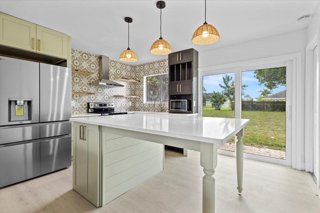 Photo of 610 SW Old Briar Avenue, Port Saint Lucie, FL 34953 (MLS # R10991311)