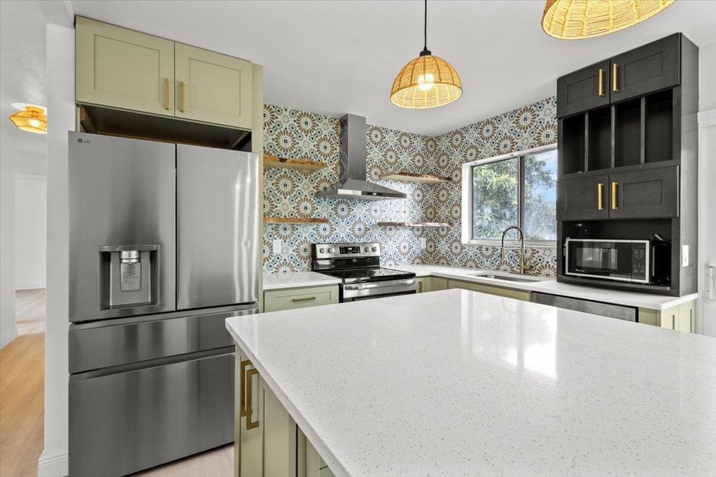 Photo of 610 SW Old Briar Avenue, Port Saint Lucie, FL 34953 (MLS # R10991311)