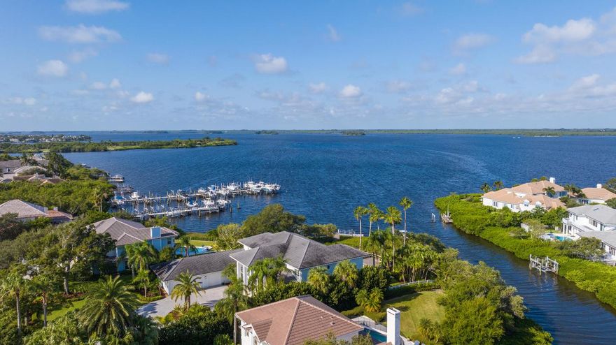 Coastal elegance defines this imposing 5 bdrm, 5 ba home! 5600+ sq ft of sumptuous finishes overlooks the Indian River on over 2/3 acre. Sweeping water views across the Intracoastal, magical sunsets mark this captivating setting. Extensive detailing throughout includes custom millwork, draperies, lighting. Huge island kitchen. Adjoining family room. Spacious dining room & light-filled dbl height living room. 2 primary suites, one up, one down. 2nd lounge w/ wet bar. Heated pool, dock w/ 6 and 9K lb lifts. 3 car AC'd garage. Convenient guard gated community w/ tennis. Dimensions approximate DISCLAIMER: Information published or otherwise provided by the listing company and its representatives including but not limited to prices, measurements, square footages, lot sizes, calculations, statistics, and videos are deemed reliable but are not guaranteed and are subject to errors, omissions or changes without notice. All such information should be independently verified by any prospective purchaser or seller. Parties should perform their own due diligence to verify such information prior to a sale or listing. Listing company expressly disclaims any warranty or representation regarding such information. Prices published are either list price, sold price, and/or last asking price. The listing company participates in the Multiple Listing Service and IDX. The properties published as listed and sold are not necessarily exclusive to listing company and may be listed or have sold with other members of the Multiple Listing Service. Transactions where listing company represented both buyers and sellers are calculated as two sales. Cooperating brokers are advised that in the event of a Buyer default, no financial fee will be paid to a cooperating Broker on the Deposits retained by the Seller. No financial fee will be paid to any cooperating broker until title passes or upon actual commencement of a lease. Some affiliations may not be applicable to certain geographic areas. If your property is currently listed with another broker, please disregard any solicitation for services. Copyright 2024 by the listing company. All Rights Reserved.