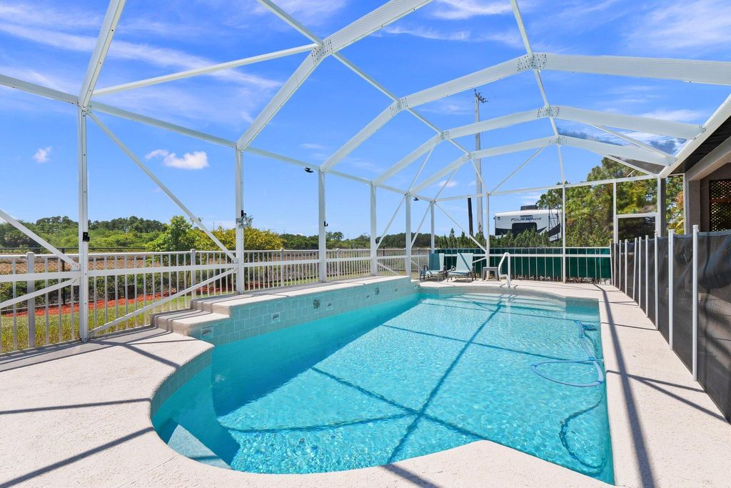 Photo of 1402 SW Abacus Avenue, Port Saint Lucie, FL 34953 (MLS # R10985439)