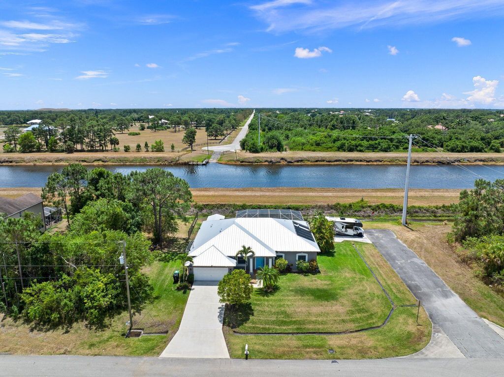 Photo of 1402 SW Abacus Avenue, Port Saint Lucie, FL 34953 (MLS # R10985439)