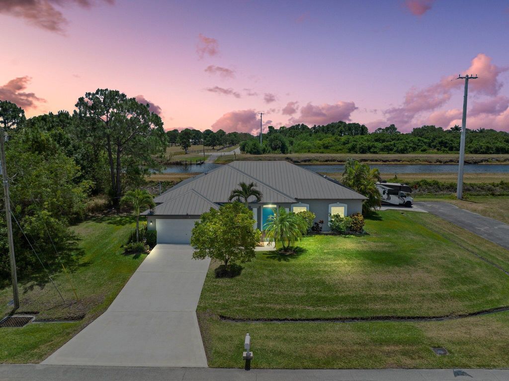 Photo of 1402 SW Abacus Avenue, Port Saint Lucie, FL 34953 (MLS # R10985439)