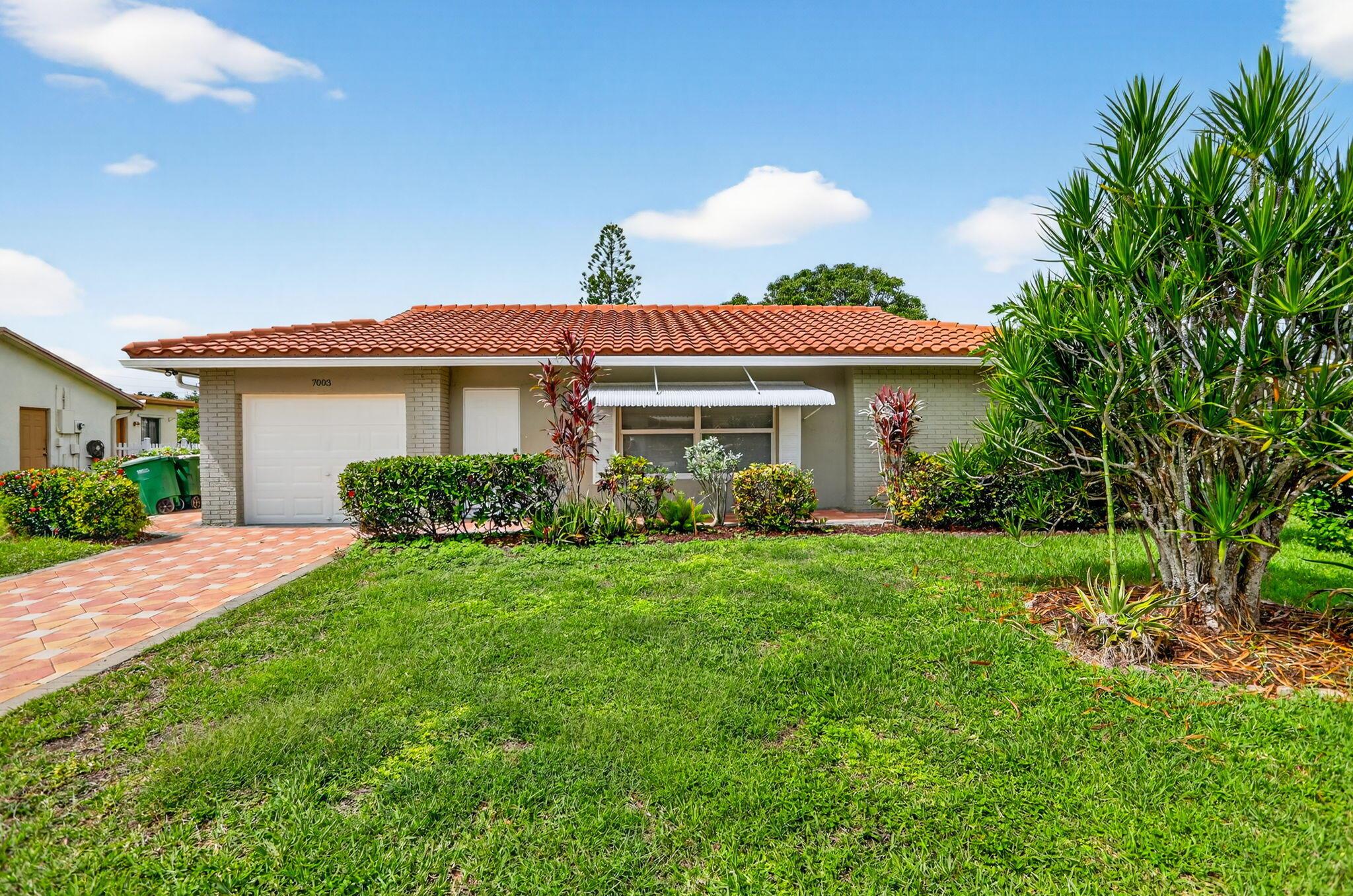 Beautifully updated home in Westwood 4 of Tamarac, a desirable 55+ community. This property features impact windows, new laminate flooring throughout, and a modern kitchen with white cabinets, granite countertops, and stainless steel appliances. The split floorplan provides privacy with a bathroom for each bedroom, ideal for guests or shared living. Enjoy a spacious screened patio perfect for relaxing or entertaining, plus a one-car garage for convenience. Low HOA fee of just $50/month includes access to a peaceful and well-maintained neighborhood. Move-in ready and waiting for its next owner!