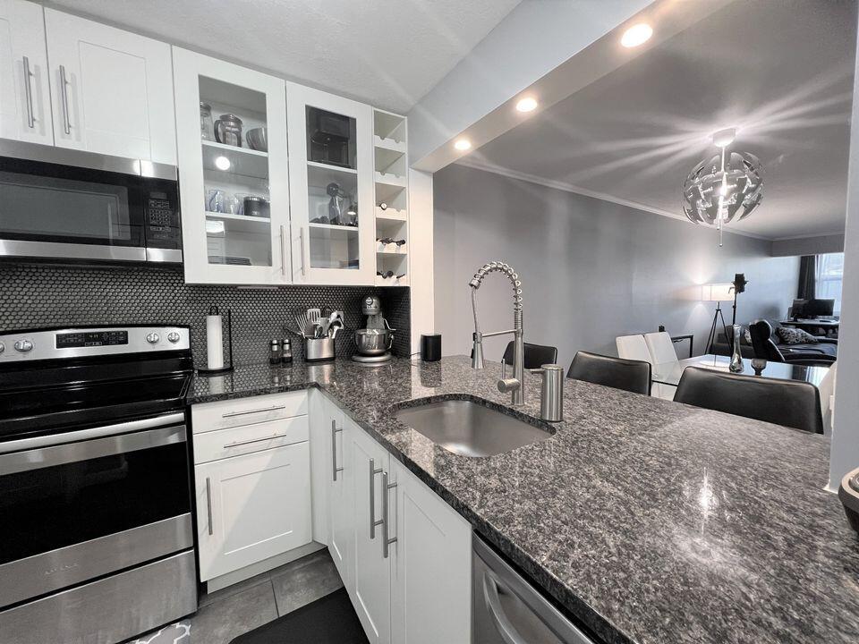 Fully Furnished & Move-In Ready! This modern 2-bedroom, 2-bath condo has been recently renovated with a sleek design and meticulous attention to detail. The open kitchen features stainless steel appliances, all-white shaker cabinets, and quartz countertops. Upgrades include hurricane-impact windows, beautiful tile, and 100% waterproof vinyl flooring throughout.Located in an all-ages community on the canal, residents enjoy a brand-new pool, renovated clubhouse, two EV charging stations, and more. Conveniently close to Whole Foods, Target, top shopping, dining, and excellent schools. HOA includes cable, water, trash, and internet. Furniture will not be removed--just bring your suitcase and start living!