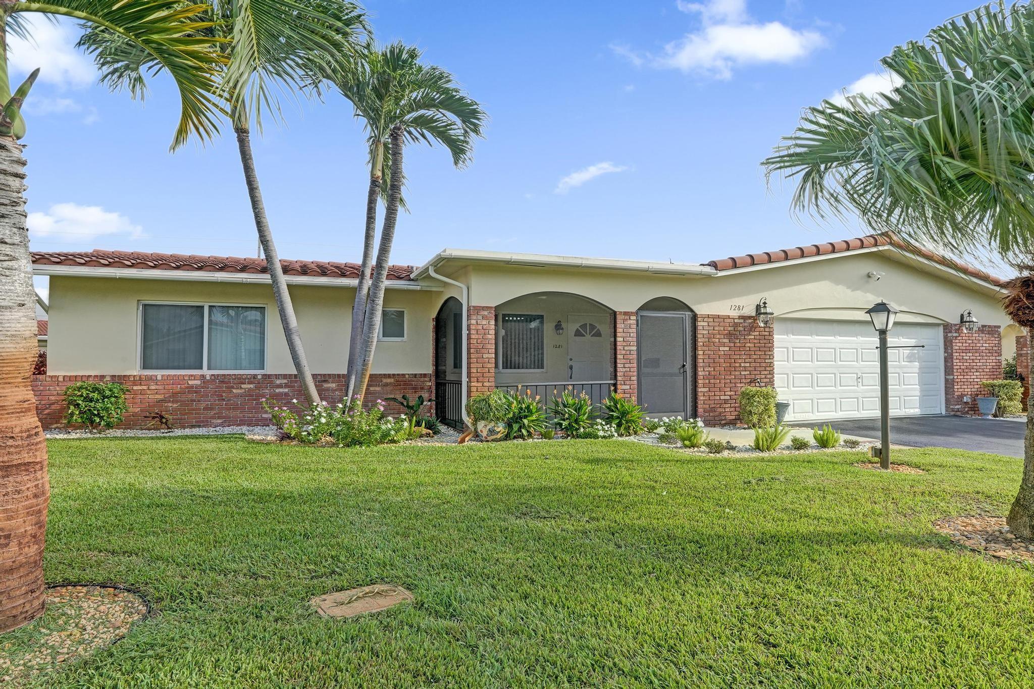 Fantastic opportunity to own a beautiful home in the 55+ community of Crystal Lakes Villas! This spacious residence offers a bright and open layout, updated kitchen and baths, freshly painted interior, and new tile flooring throughout. Enjoy extra living space with a large family room and office, which could easily serve as a 3rd bedroom. The screened patio provides the perfect spot to relax, and the oversized 2-car garage adds great convenience. Impact windows provide peace of mind. The community takes care of water, trash, lawn care, sprinklers, roof cleaning, house painting, and driveway sealing — making this home truly move-in ready. Come see it today!