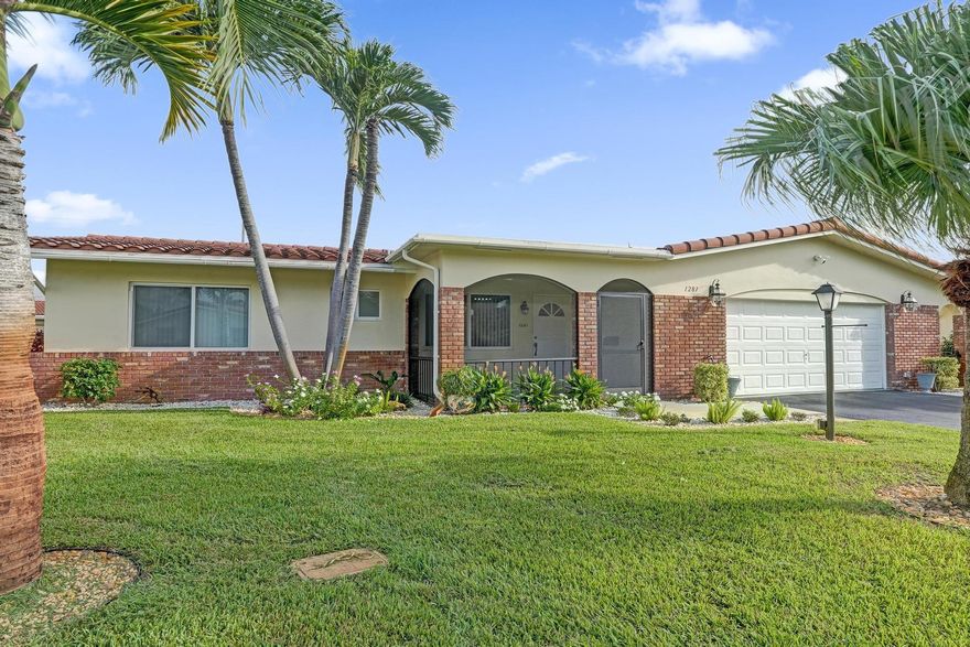 Fantastic opportunity to own a beautiful home in the 55+ community of Crystal Lakes Villas! This spacious residence offers a bright and open layout, updated kitchen and baths, freshly painted interior, and new tile flooring throughout. Enjoy extra living space with a large family room and office, which could easily serve as a 3rd bedroom. The screened patio provides the perfect spot to relax, and the oversized 2-car garage adds great convenience. Impact windows provide peace of mind. The community takes care of water, trash, lawn care, sprinklers, roof cleaning, house painting, and driveway sealing — making this home truly move-in ready. Come see it today!
