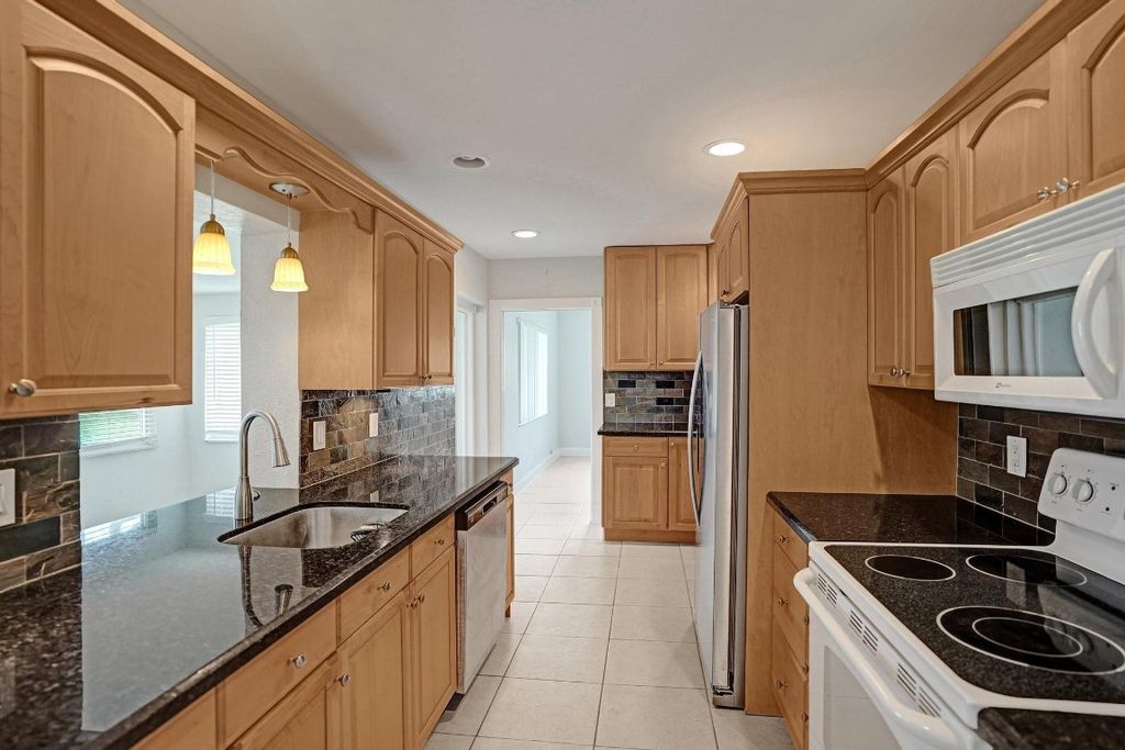 Photo of 1281 NW 44th Street, Deerfield Beach, FL 33064 (MLS # F10529541)